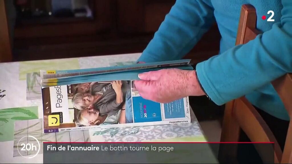 Recherche d'un particulier dans l'annuaire Pages Blanches affiché sur un écran